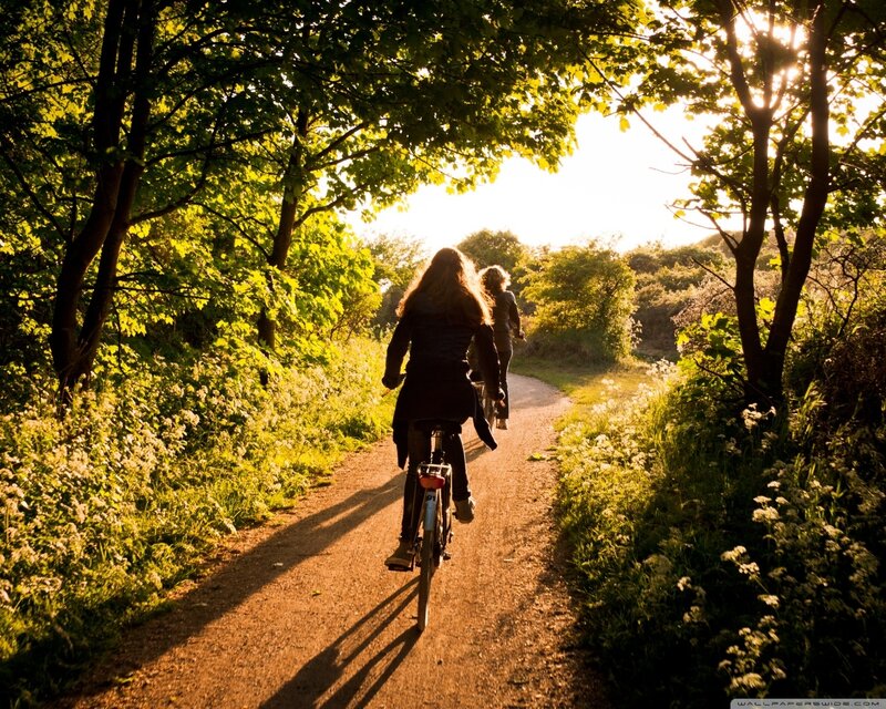 Two People Cycling
