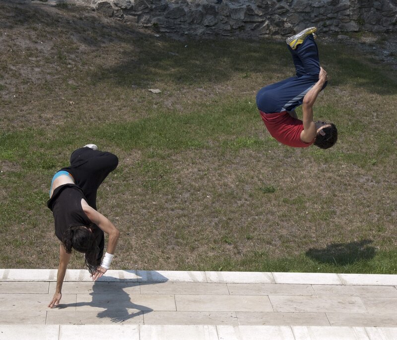 Two people doing acrobatics
