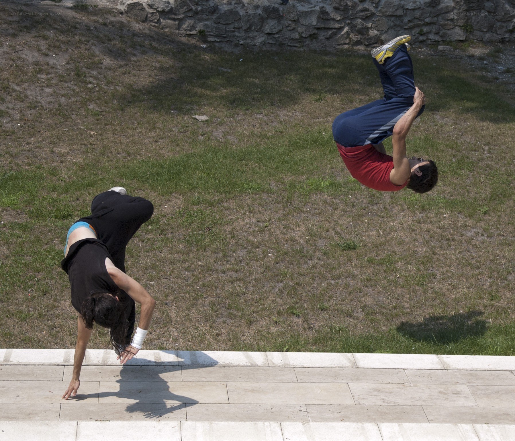 Two people doing acrobatics