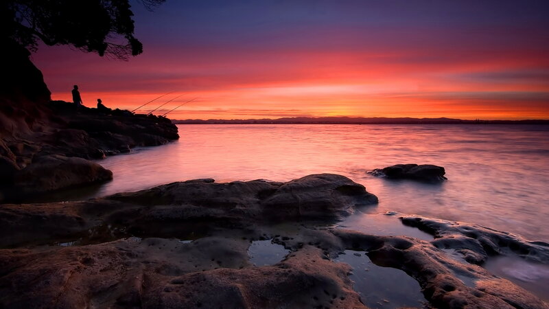 Two People Fishing at Sunset — Red