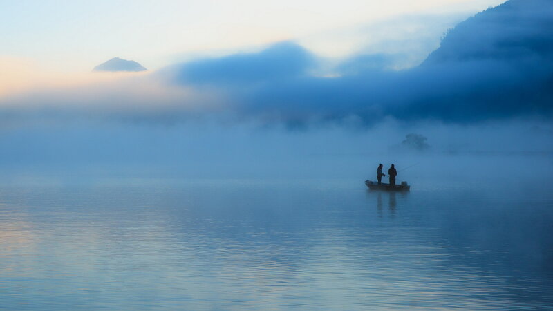 Two People Fishing in a Boat — Blue