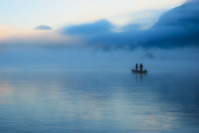 Two People Fishing in a Boat