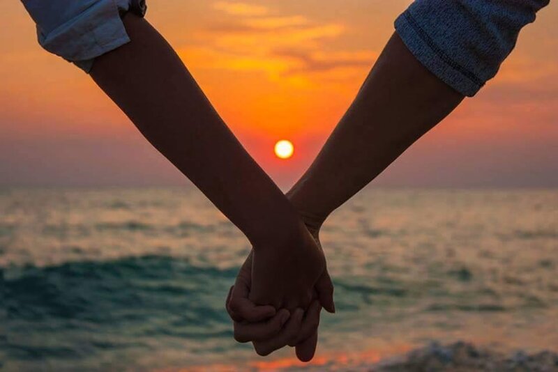 Two People Holding Hands — Orange, Serene, Sunset