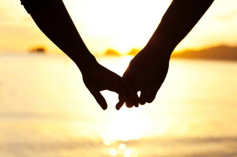 Two People Holding Hands — Yellow