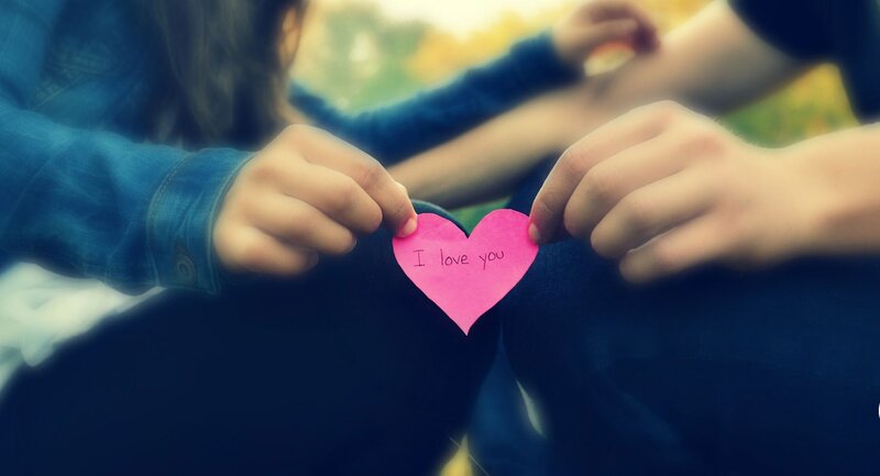 Two People Holding Heart