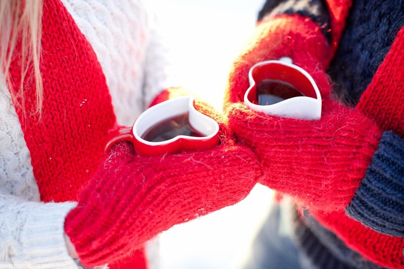 Two People Holding Mugs