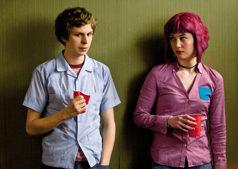 Two people holding red cups