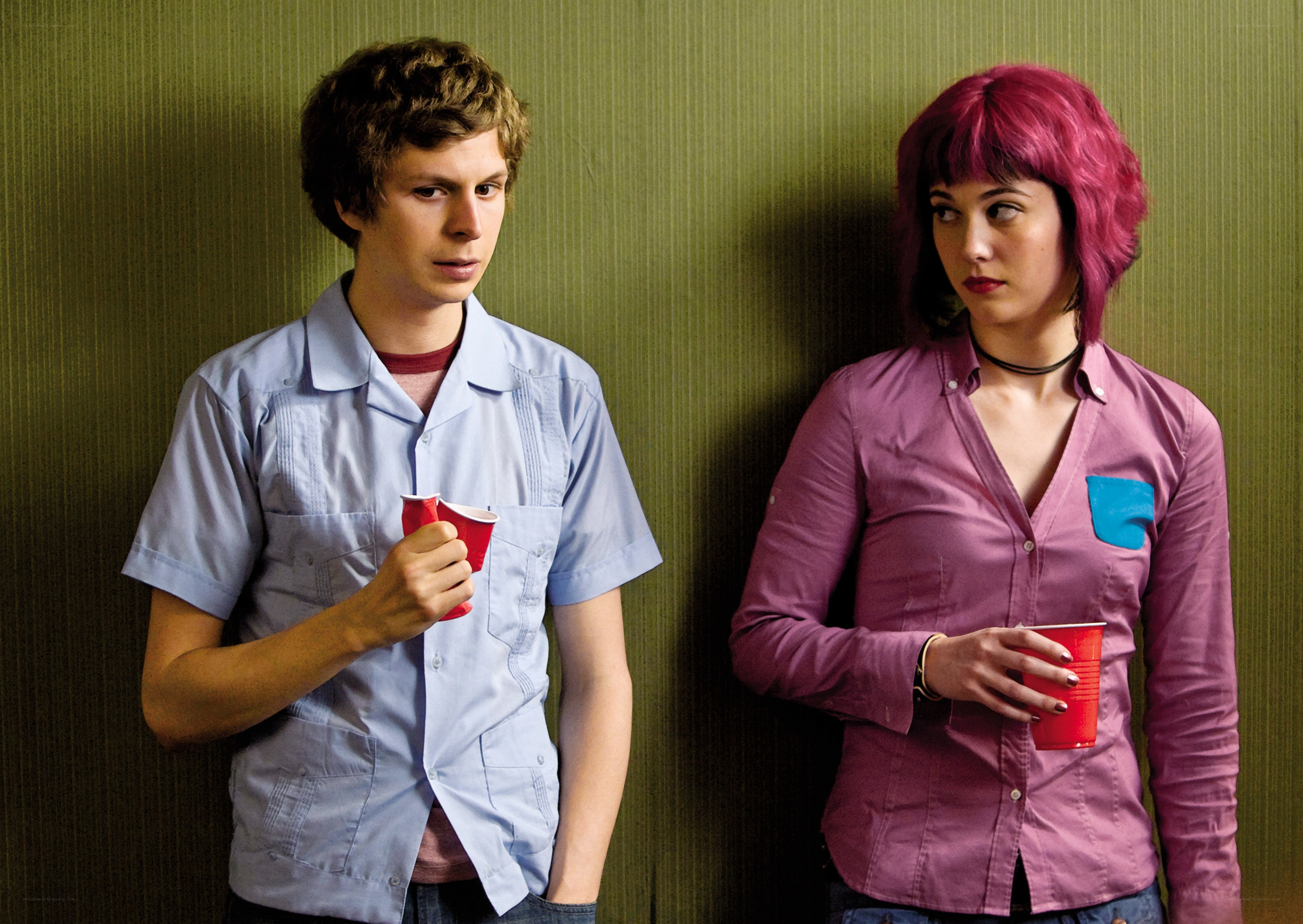 Two people holding red cups