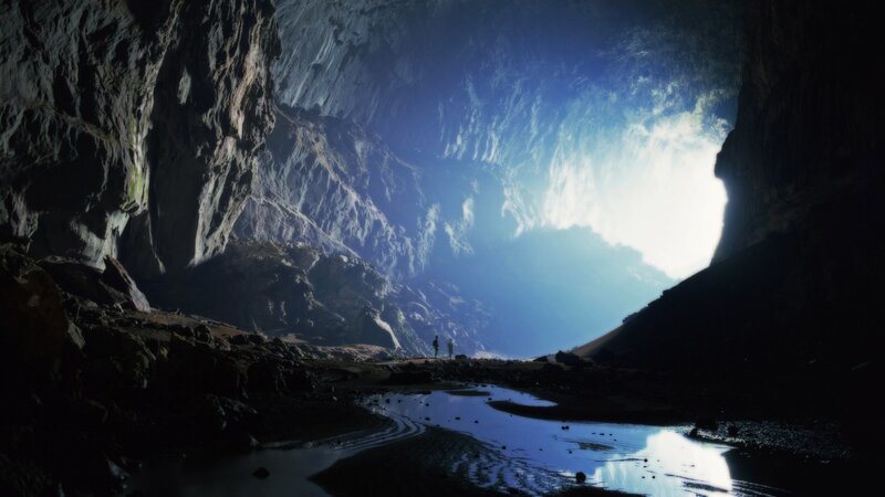 Two People in a Cave — Blue, Dramatic, Photograph