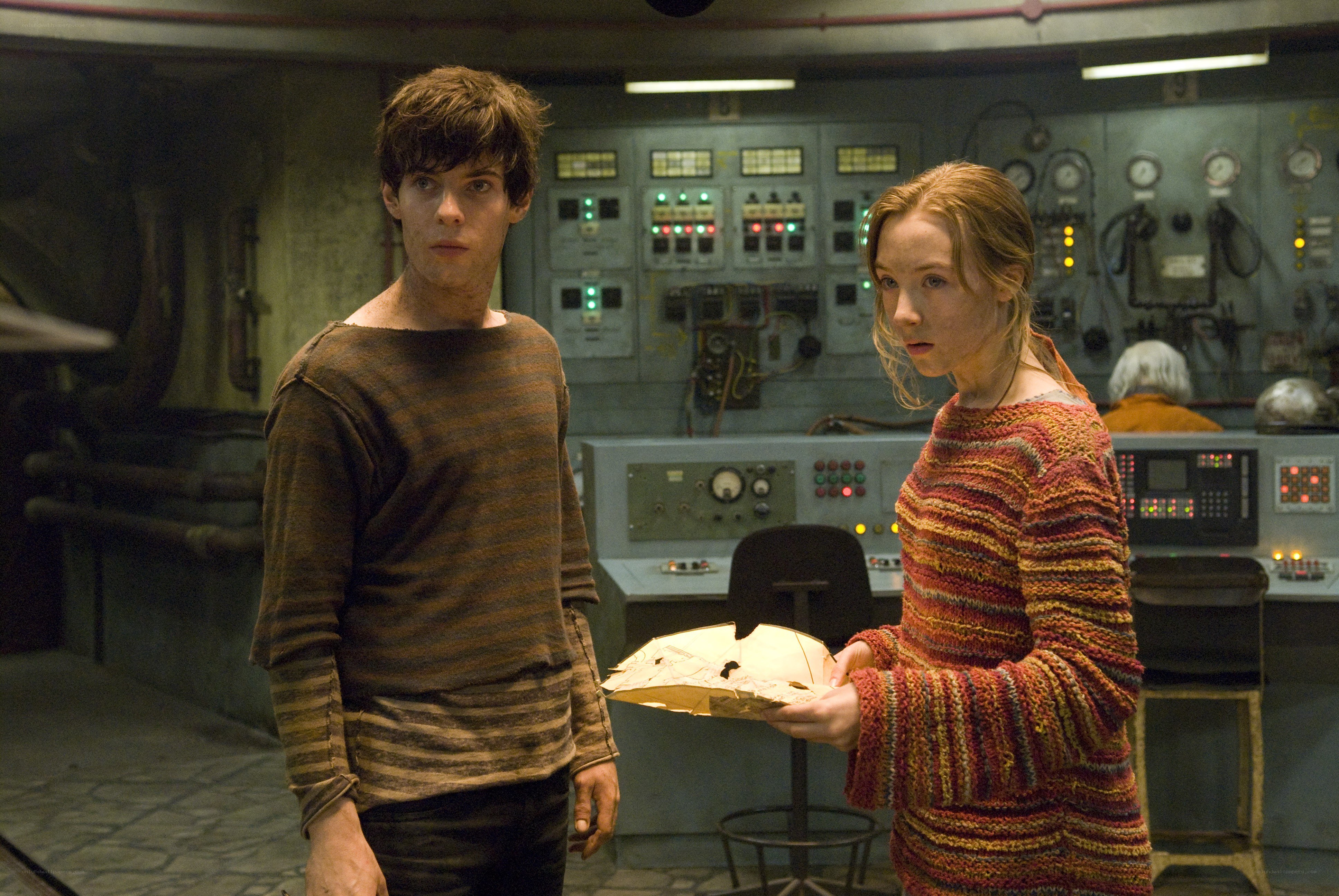 Two people in a control room