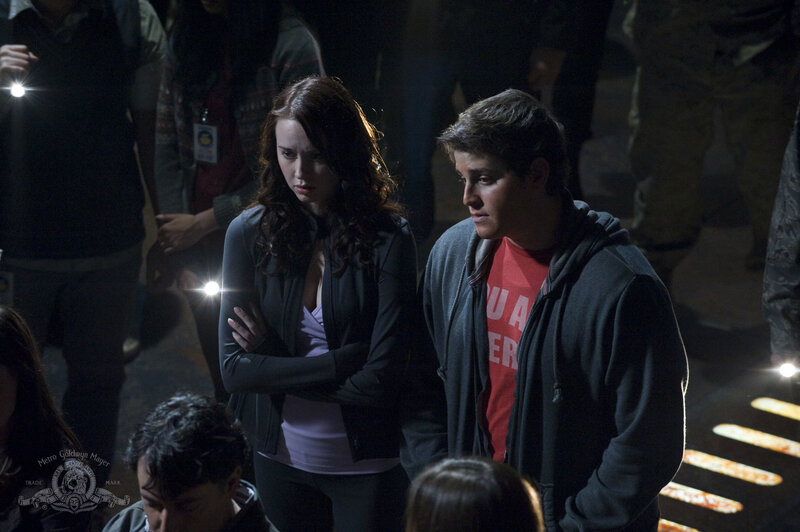 Two people in a dark crowd