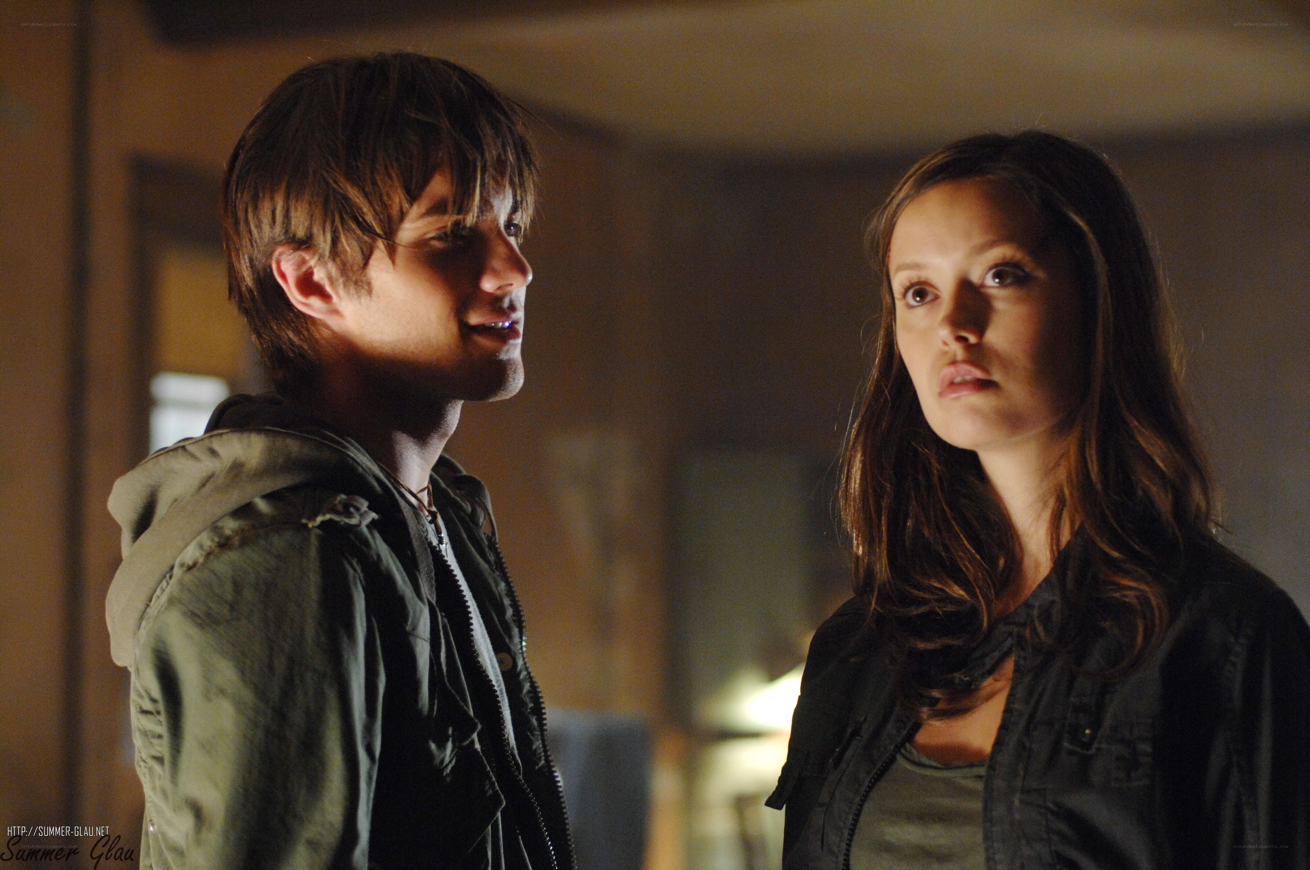 two people in a dimly lit room