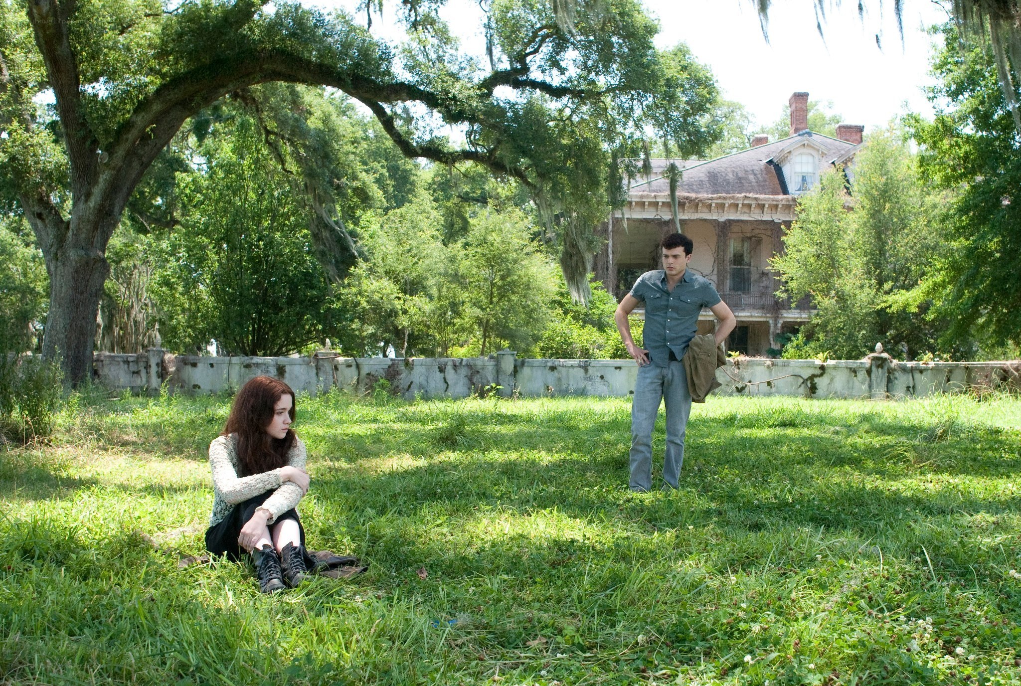 Two people in a grassy yard