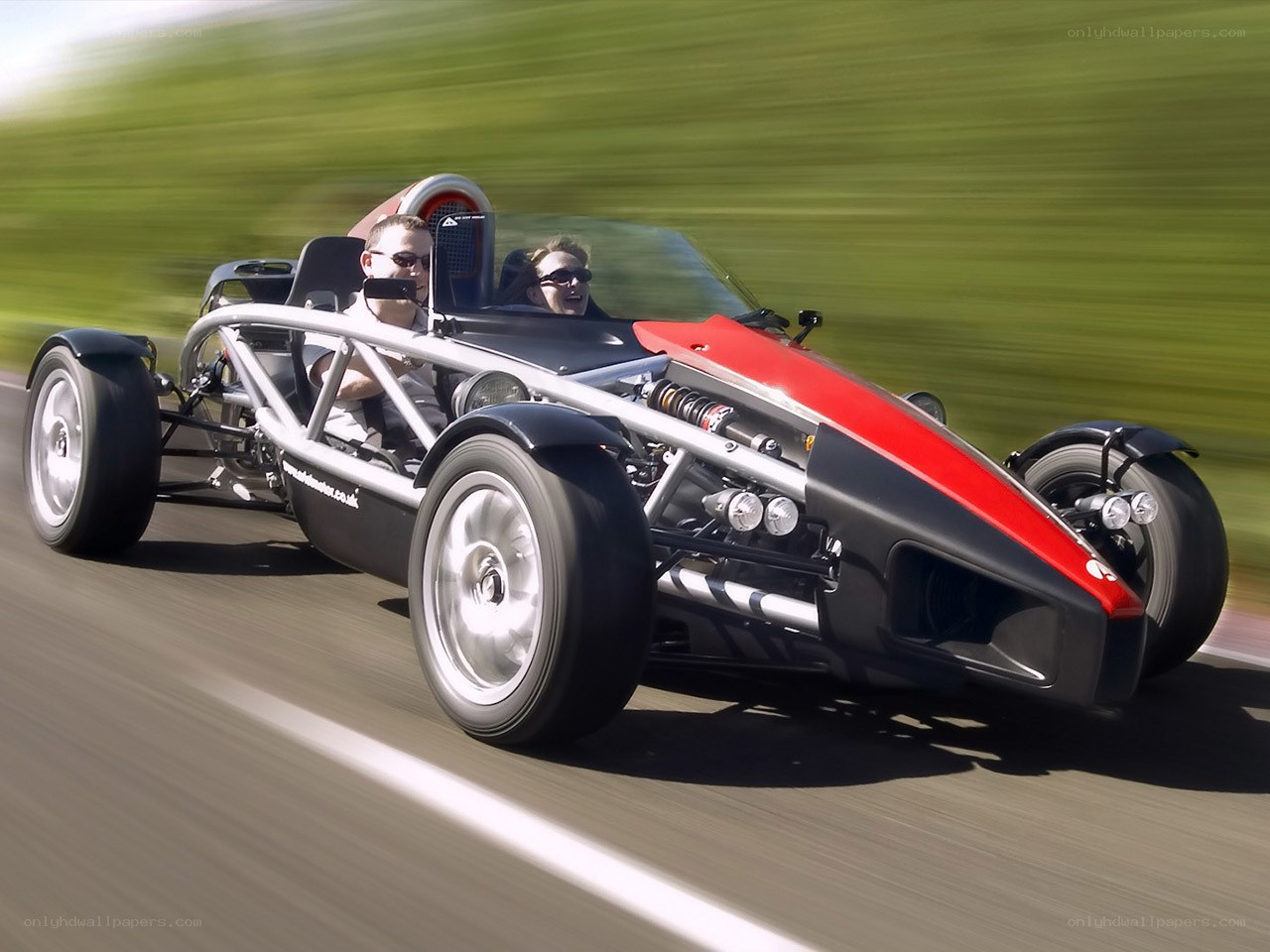 Two people in a racing car