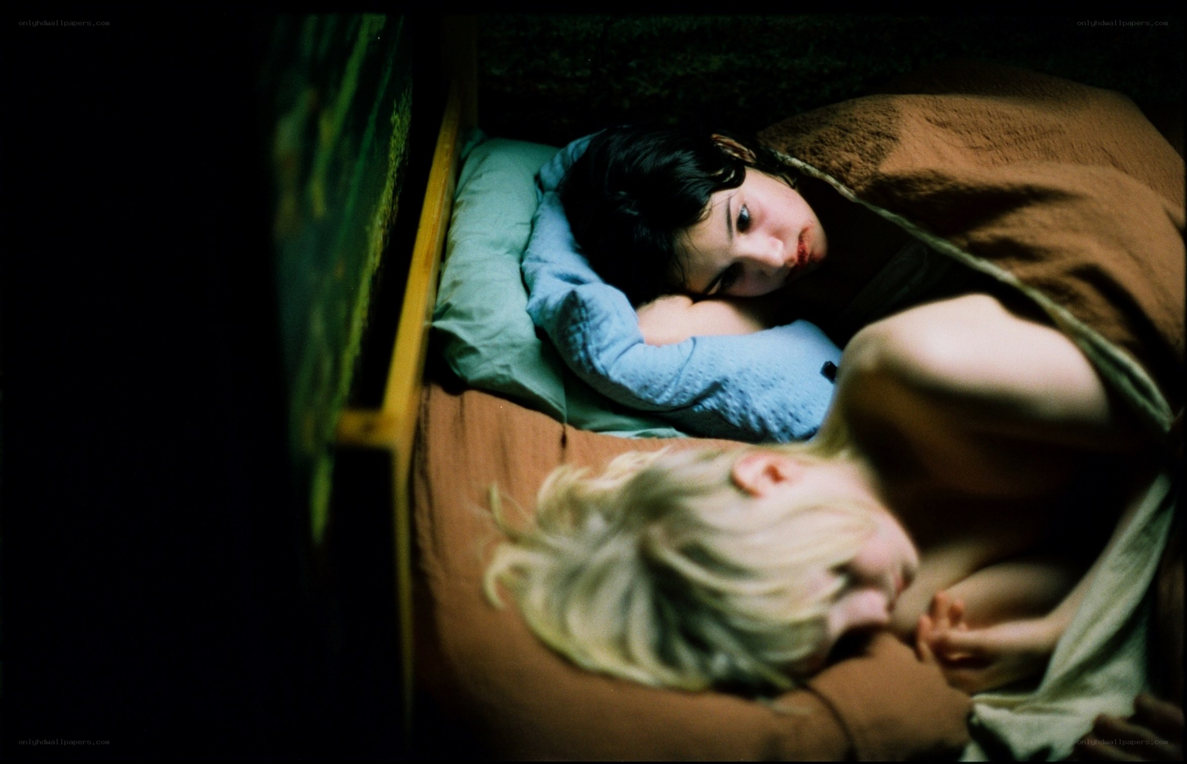 Two people in bed at night