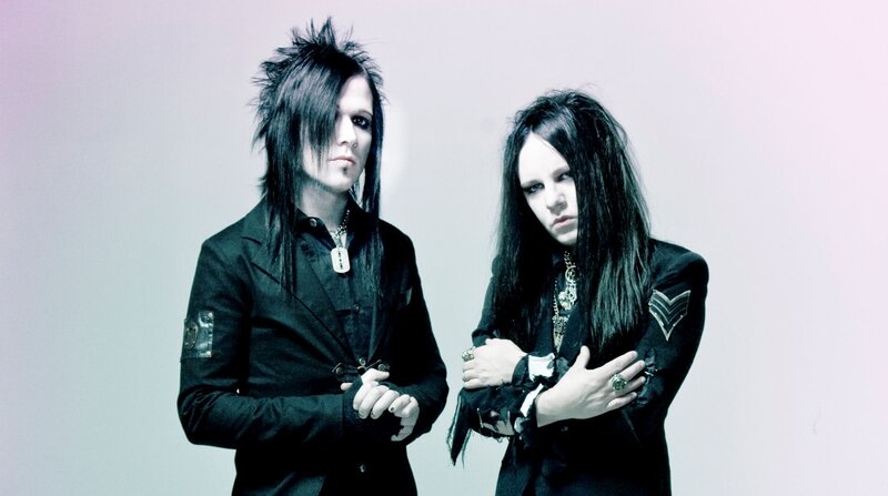 Two People in Black Clothing — Serious