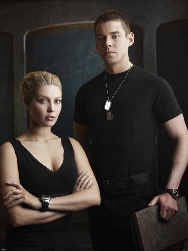 two people in black clothing