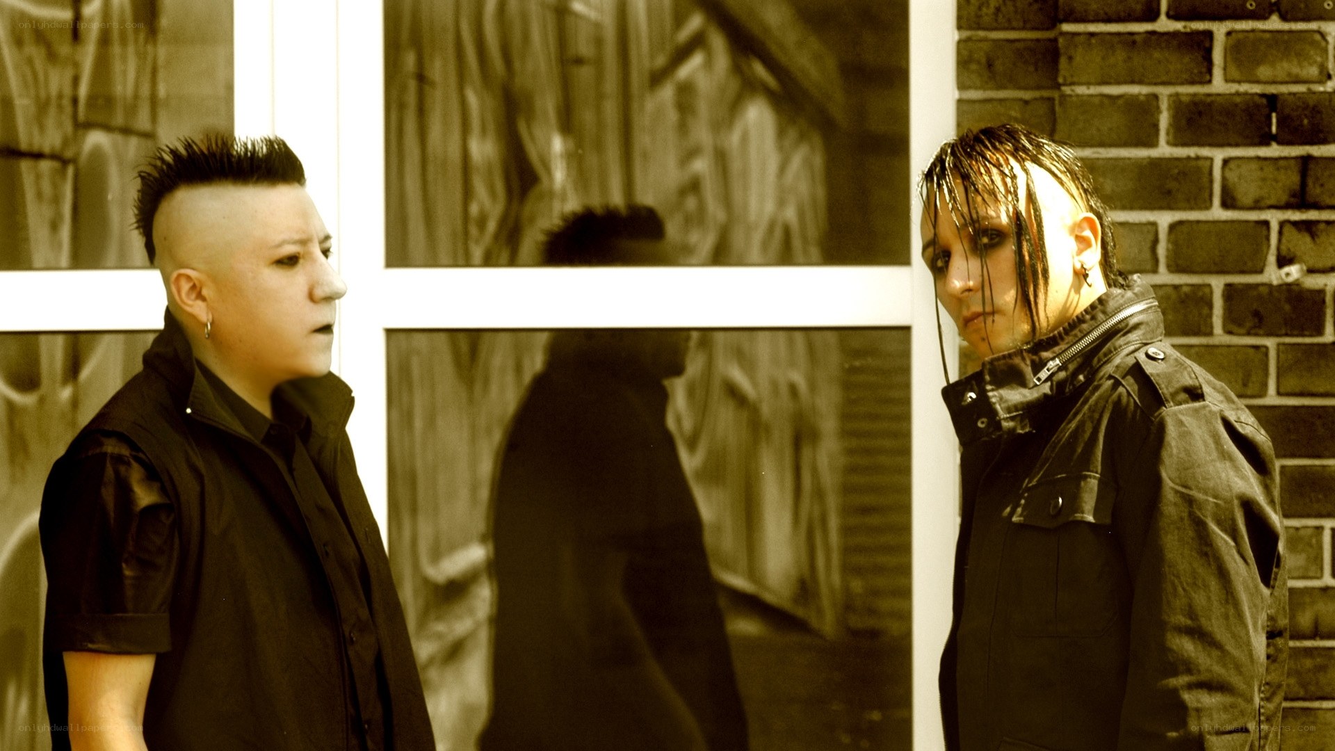 two people in dark clothing