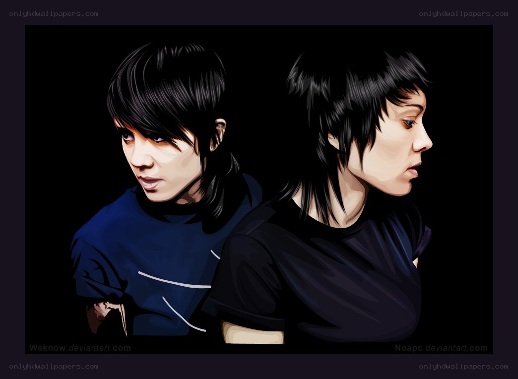 two people in dark clothing