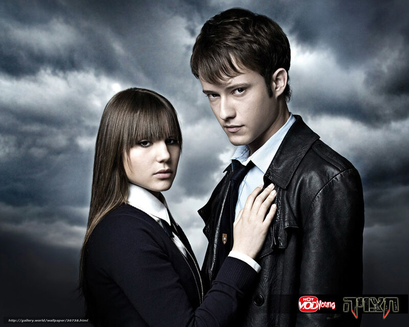 two people in dark clothing