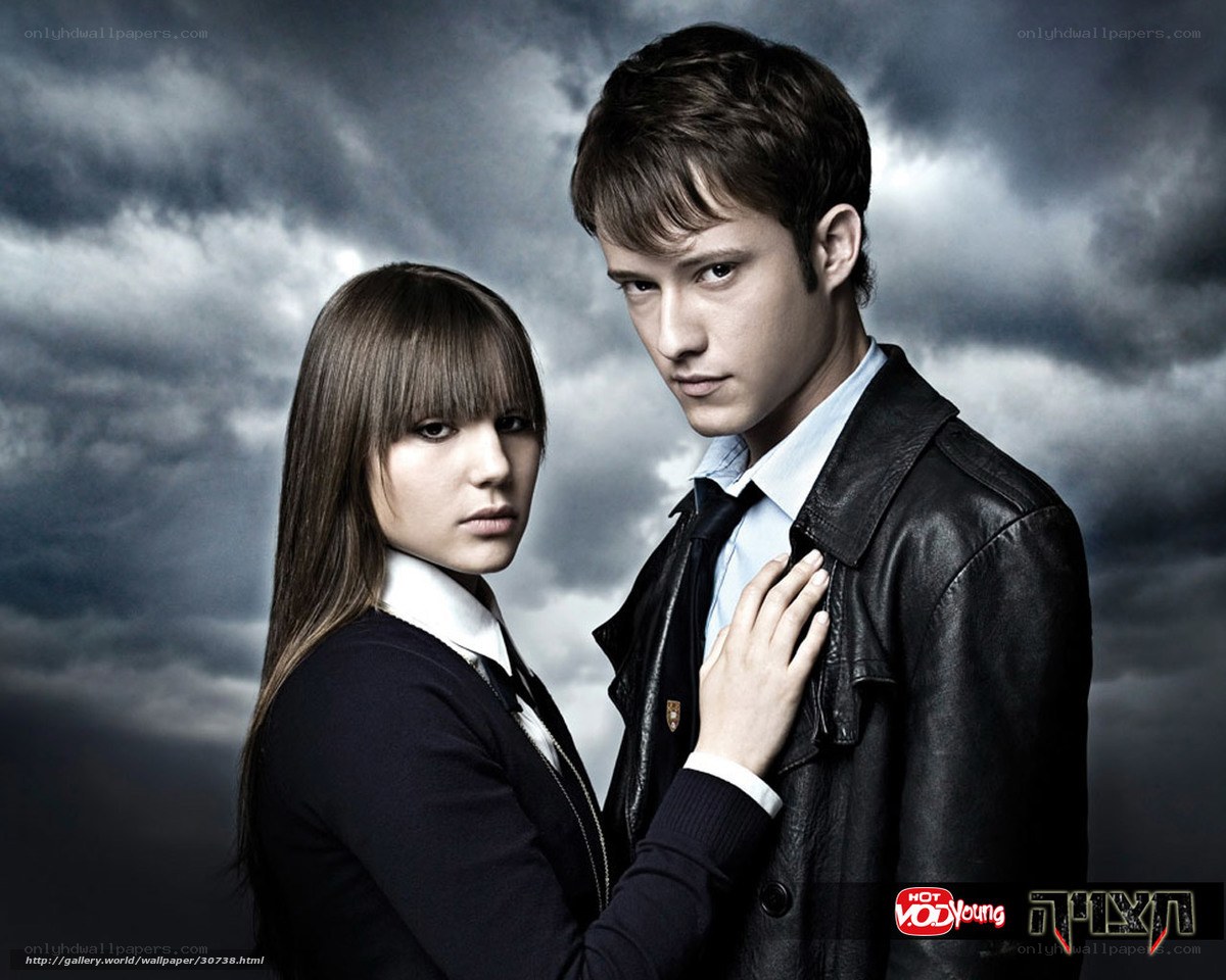 two people in dark clothing