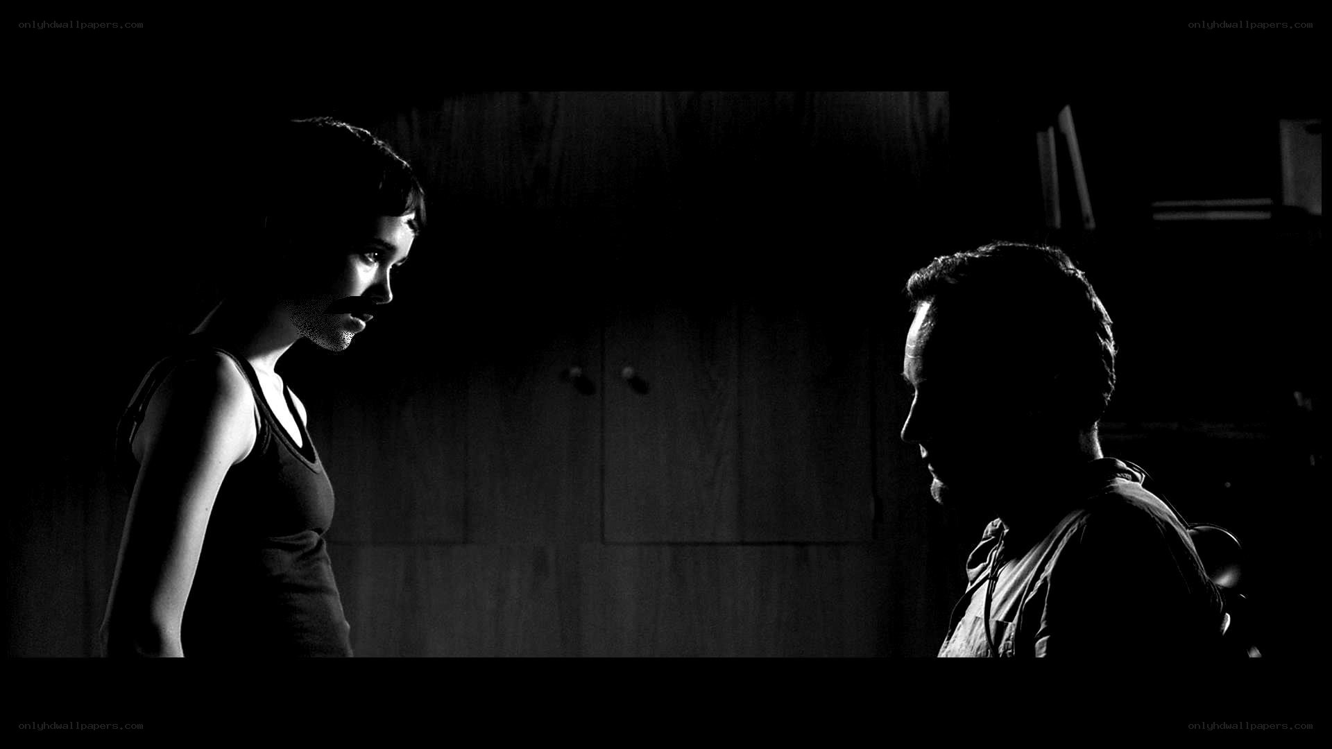 two people in dim light