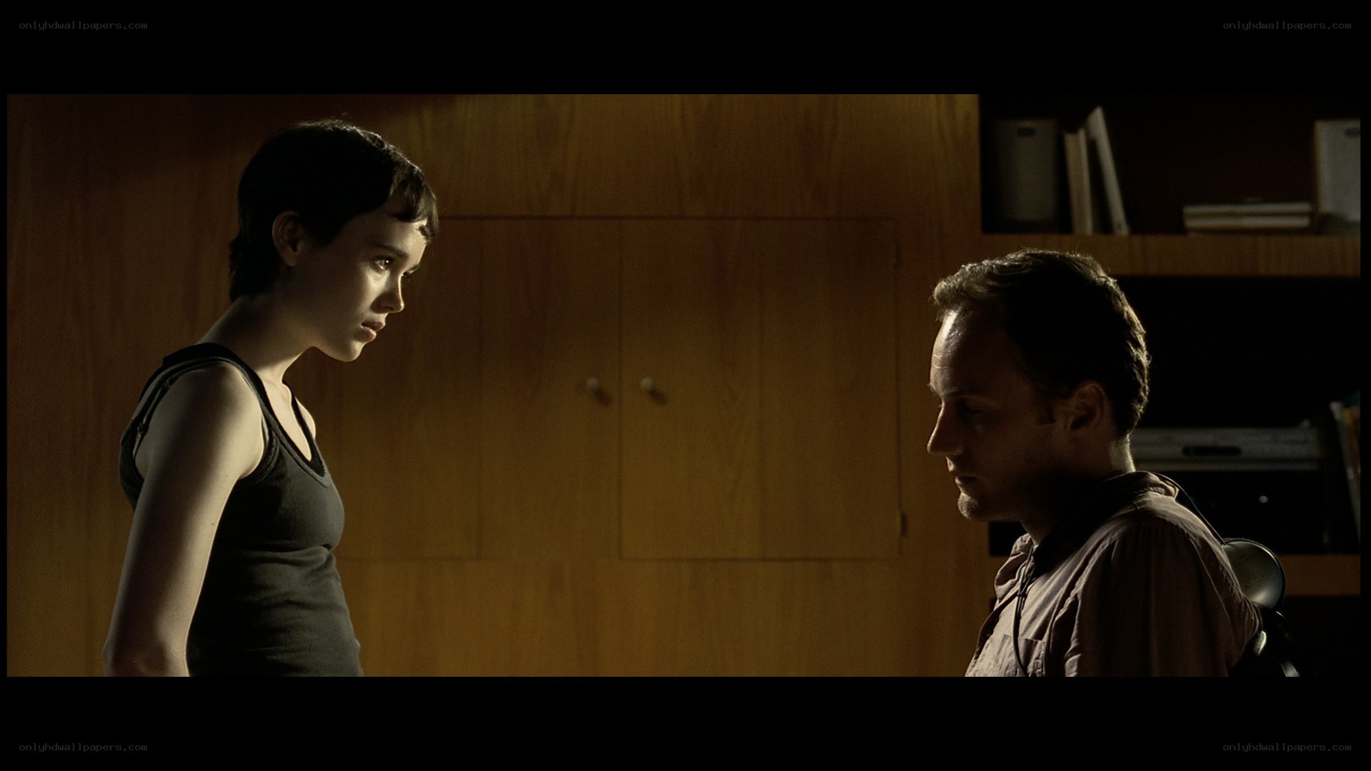two people in dimly lit room