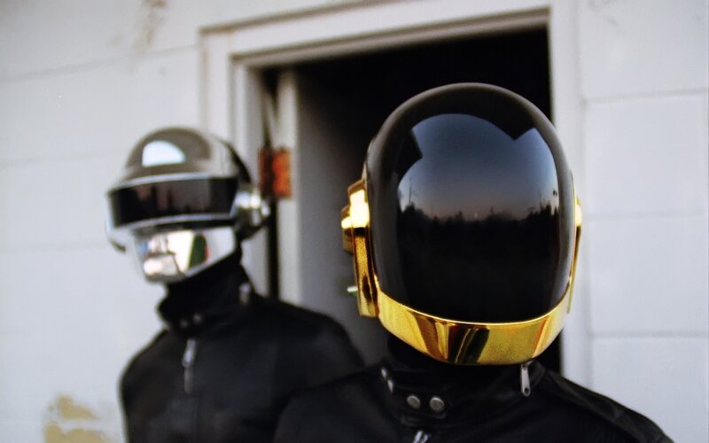 Two People in Helmets — Black, Dramatic, Photograph, Doorway, White Wall