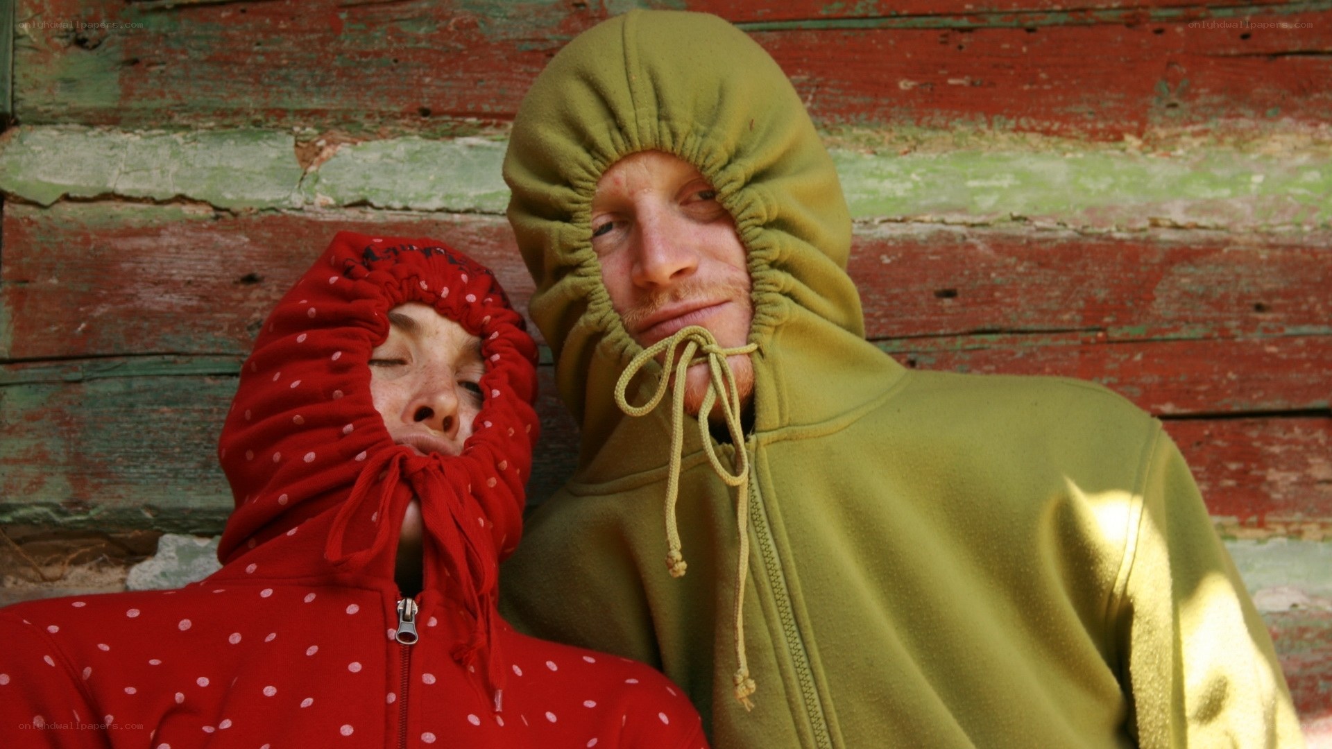 Two people in hooded sweatshirts