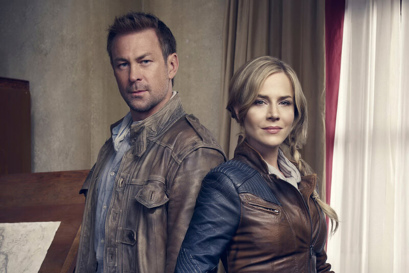 two people in leather jackets