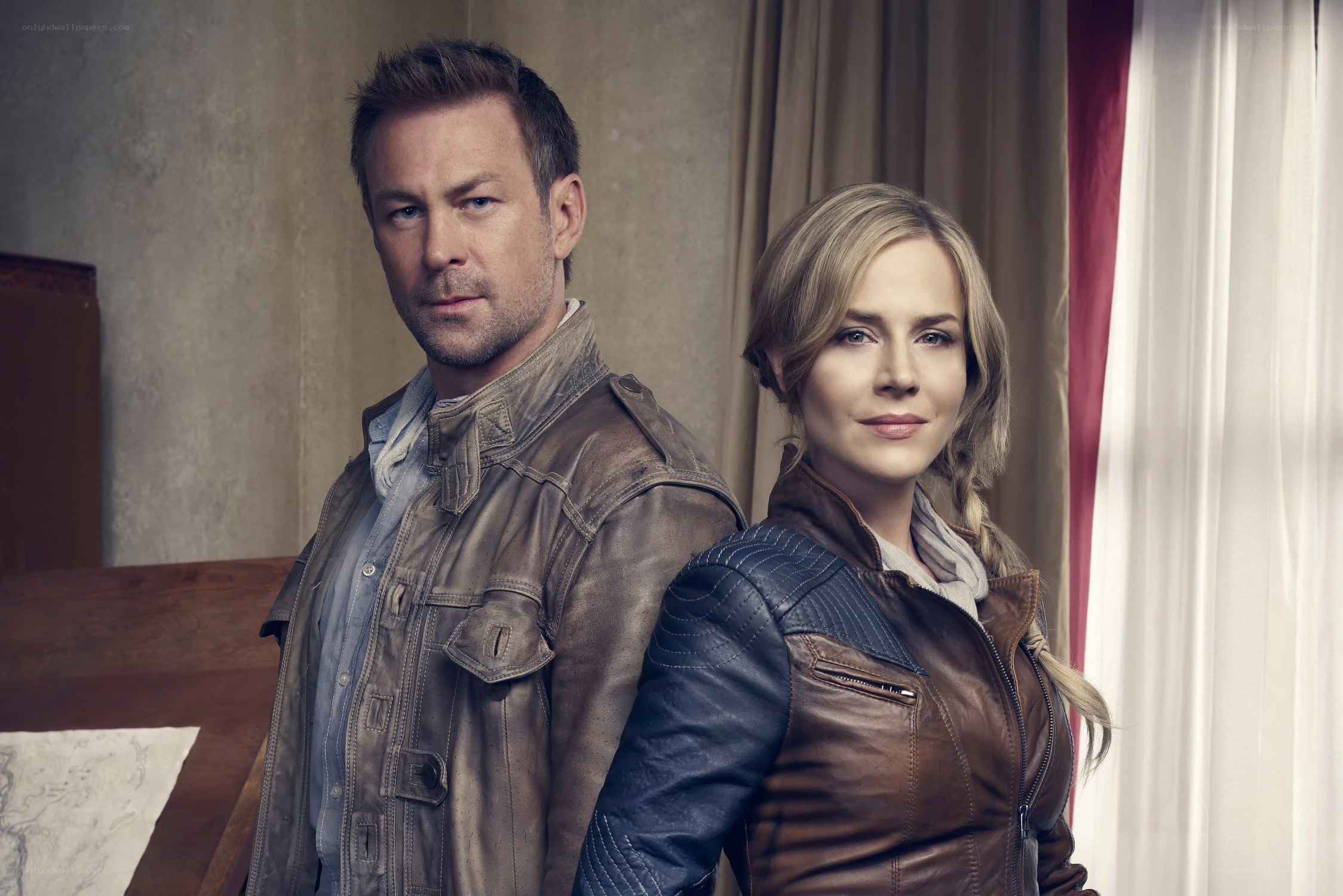 two people in leather jackets