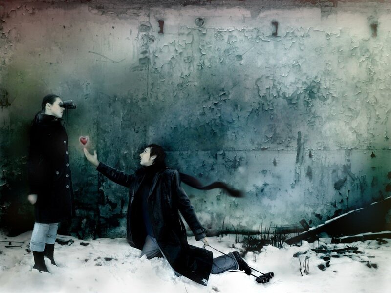 Two people in snowy scene with heart