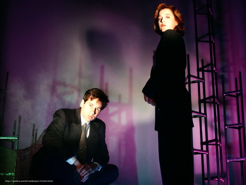 two people in suits on stage