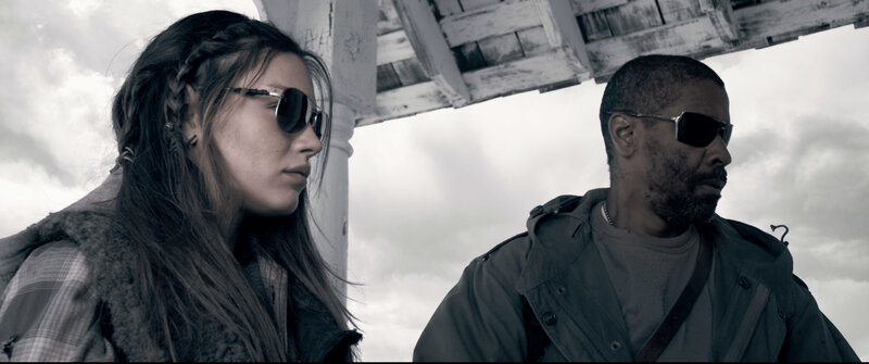two people in sunglasses under shelter