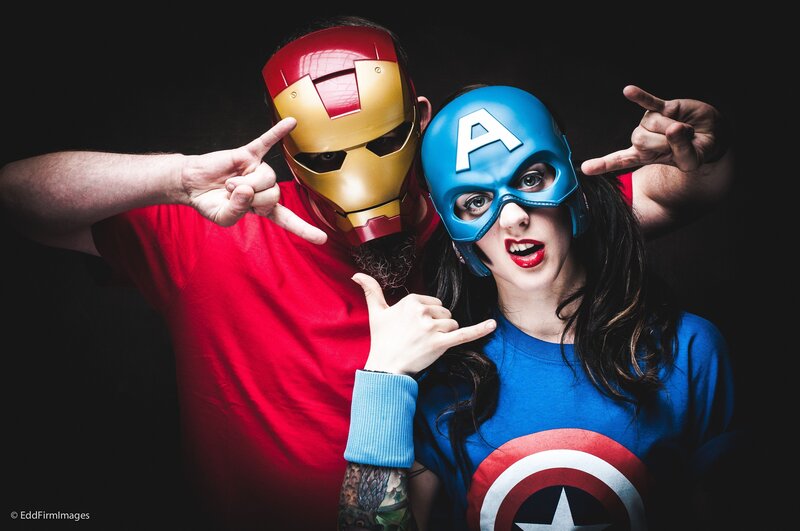 Two People in Superhero Costumes — Red