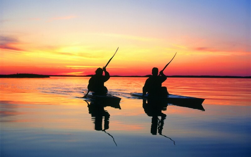 Two People Kayaking — Orange, Serene