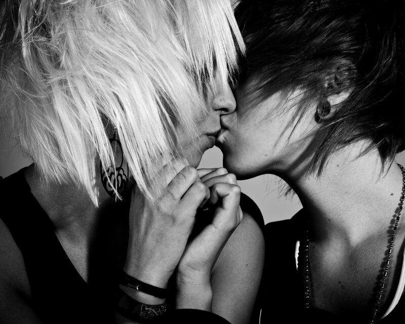 two people kissing in black and white