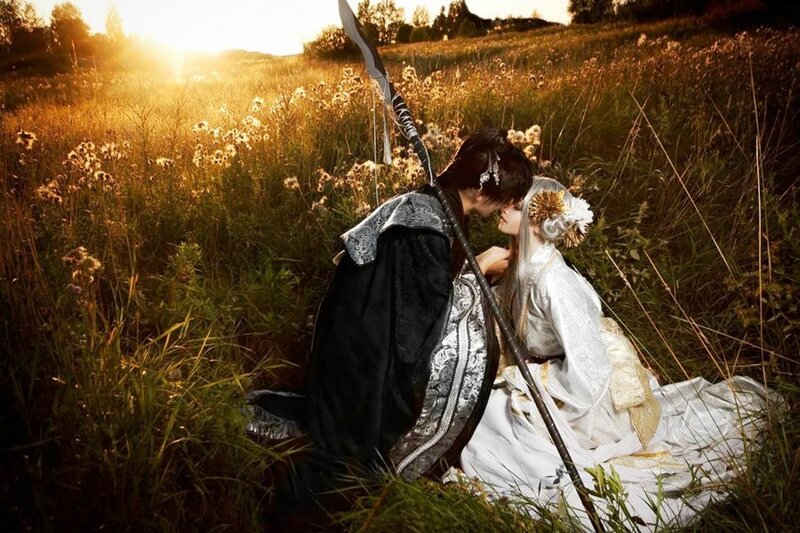 Two People Kissing in Field