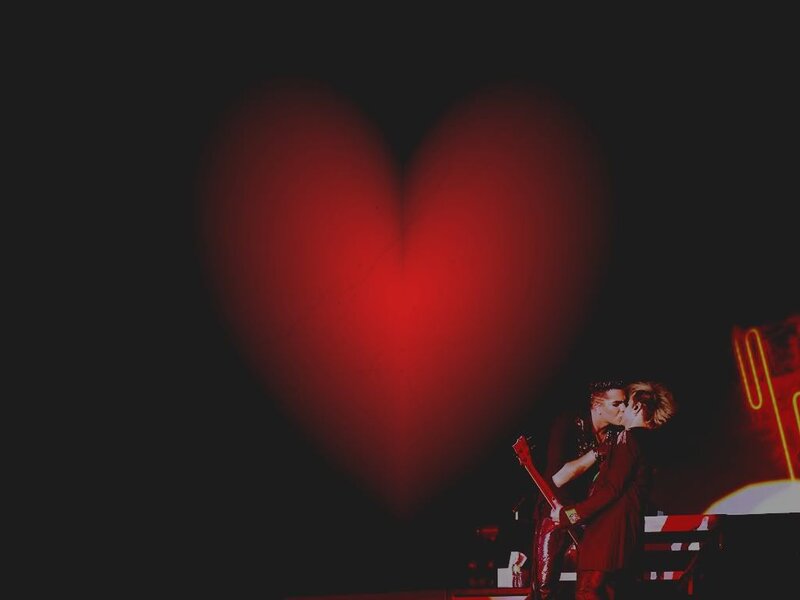Two People Kissing on Stage