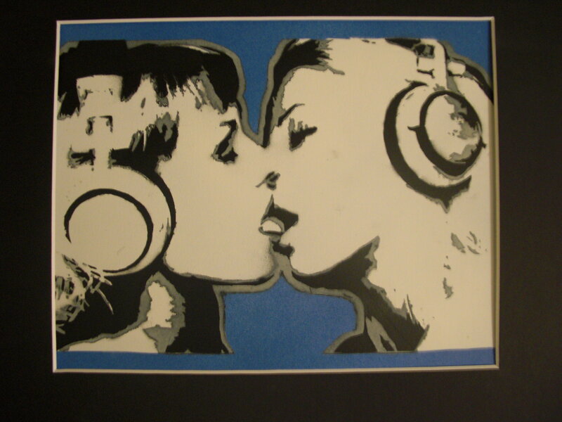 two people kissing with headphones