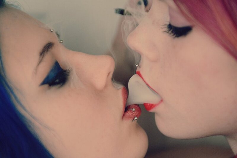 two people kissing with piercings