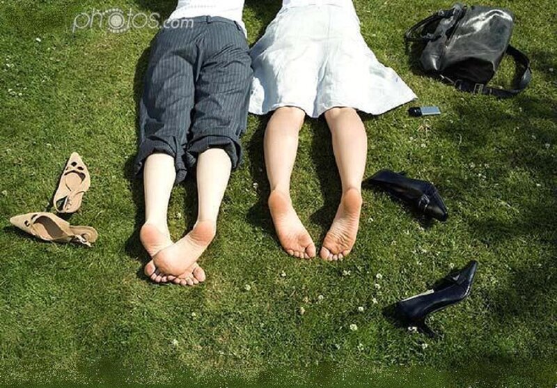 Two People Lying on Grass — Green