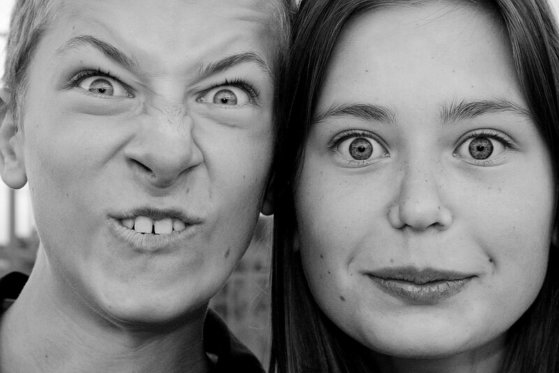 Two people making funny faces