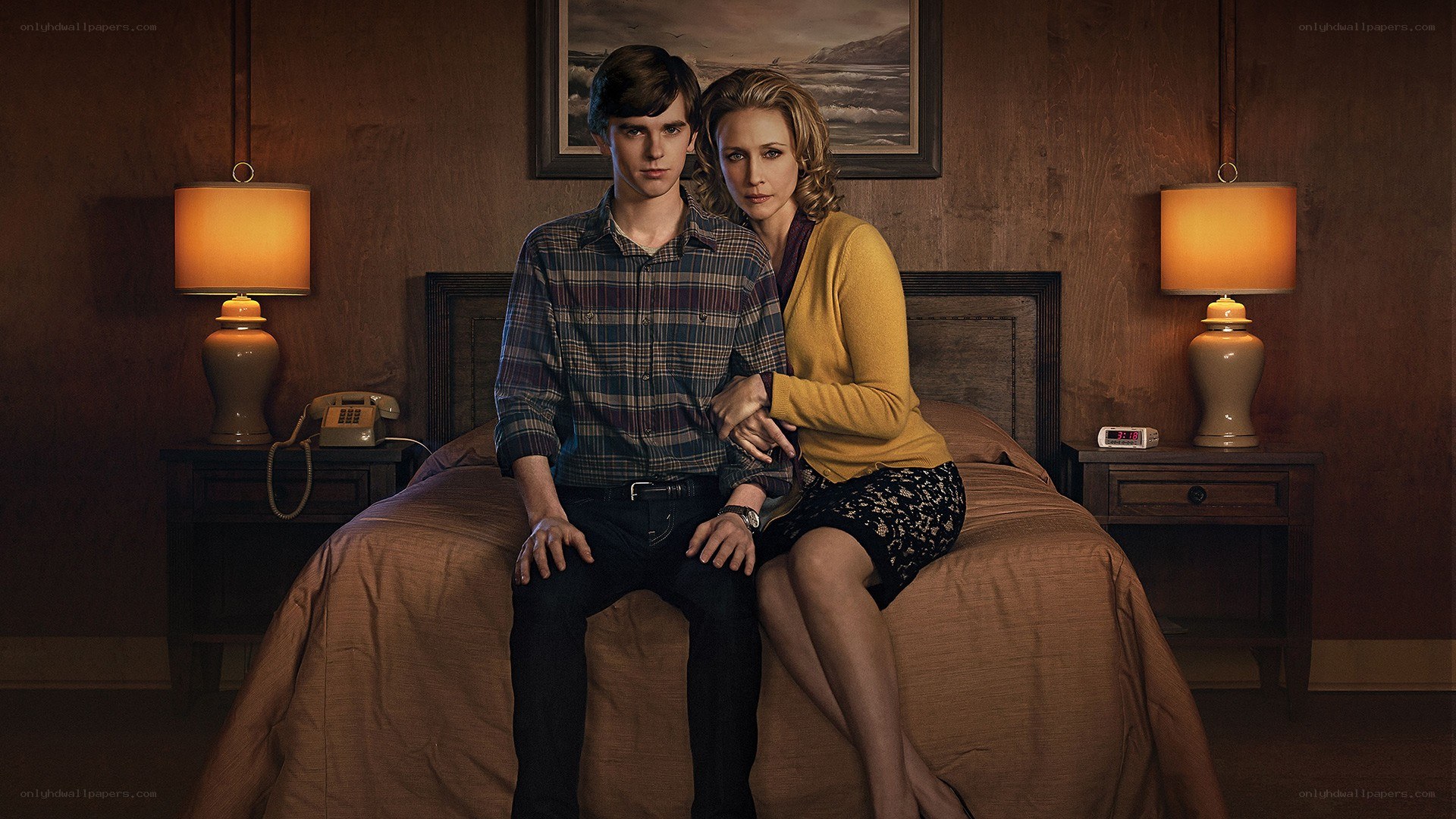 Two people on a bed in a room