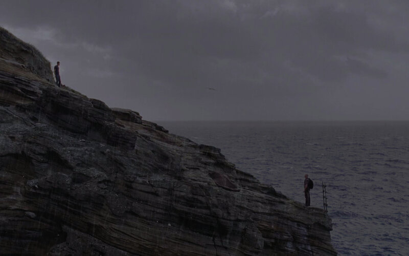 two people on a cliff