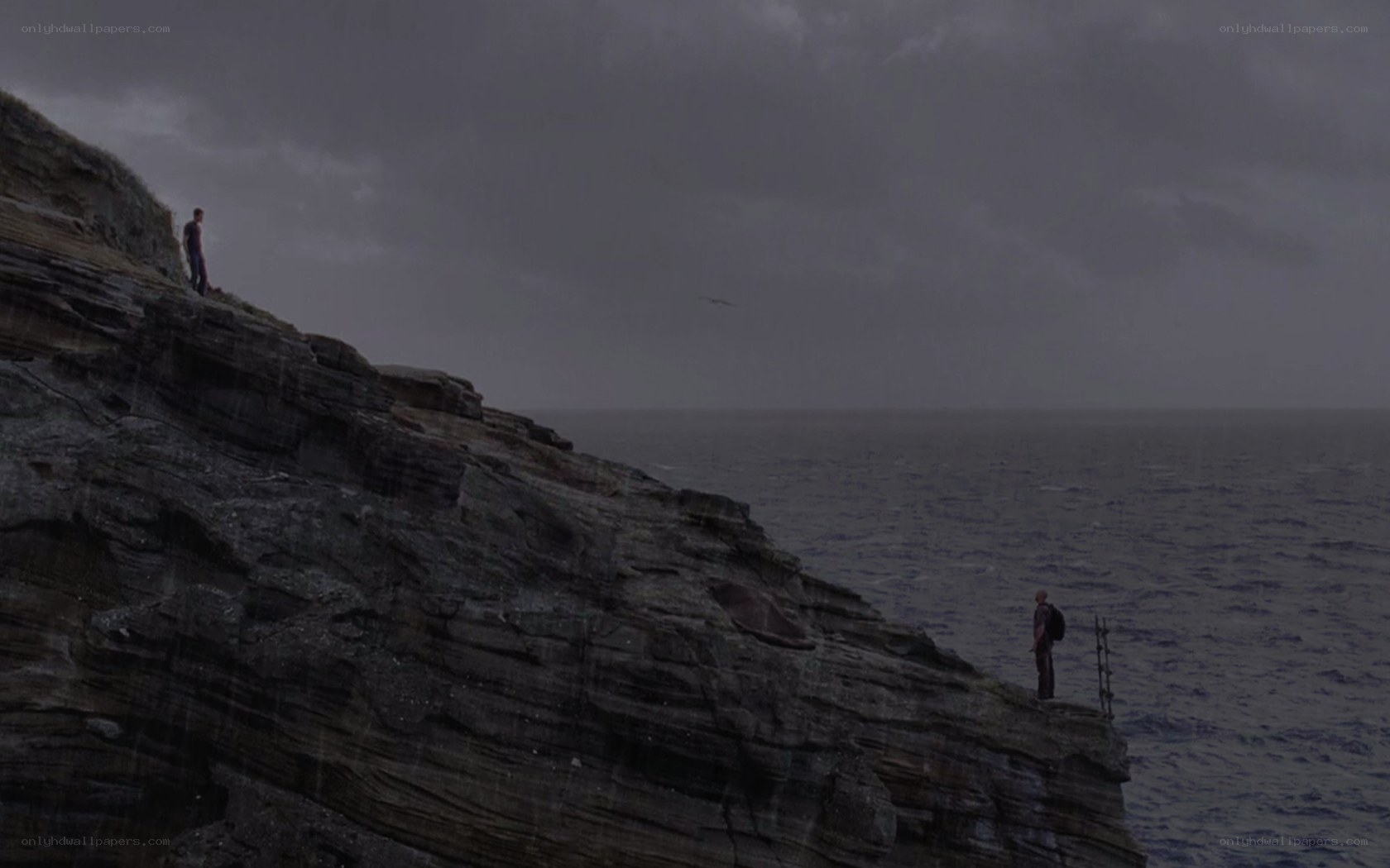 two people on a cliff