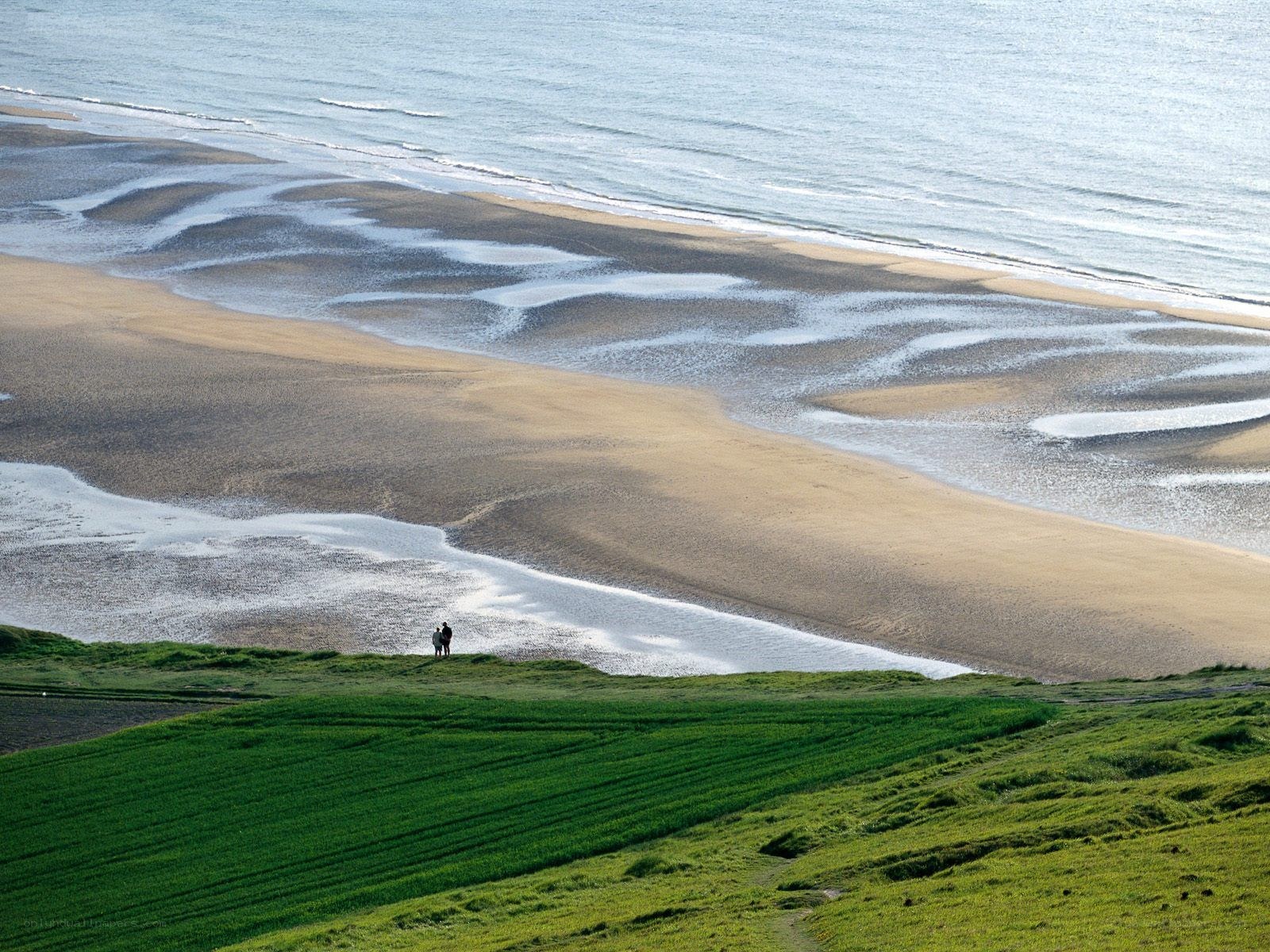 Two people on a coastal cliff