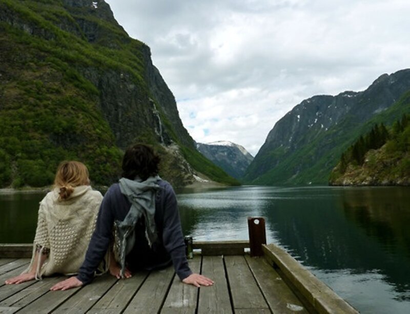 Two People on a Dock — Green, Serene, Afternoon