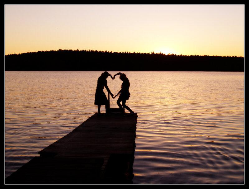 Two People on a Dock — Orange