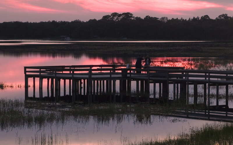 Two People on a Dock — Pink